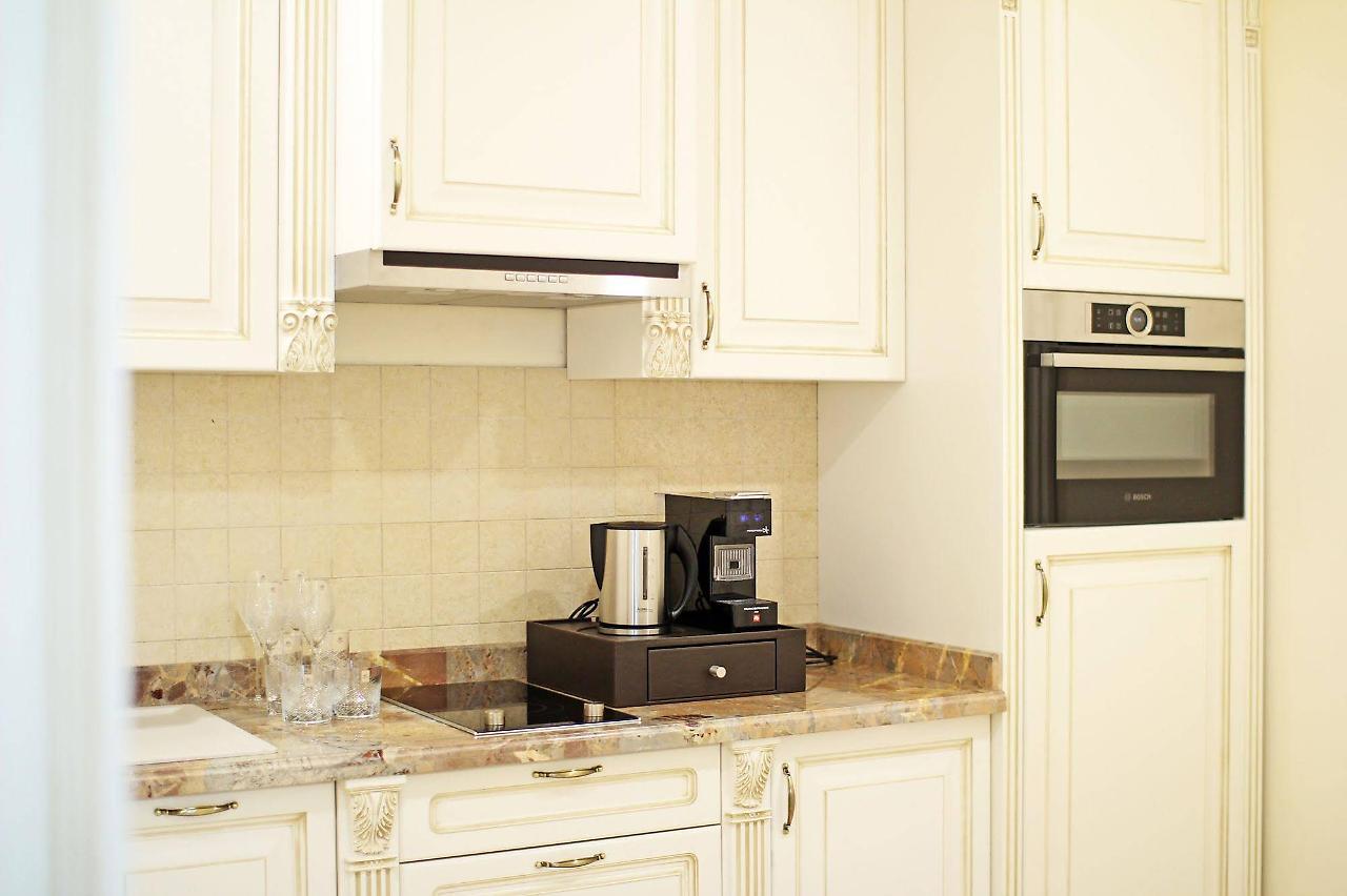 Orion Hotel Bishkek Exterior foto A coffee machine in a kitchen