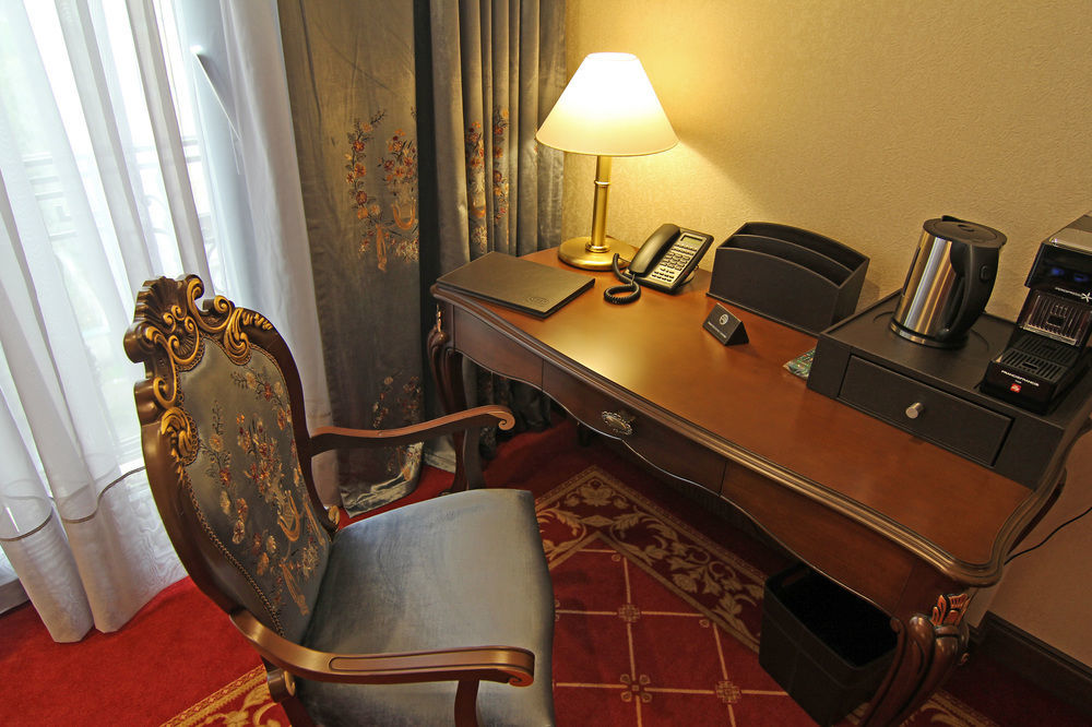 Orion Hotel Bishkek Exterior foto A writing desk in a hotel room